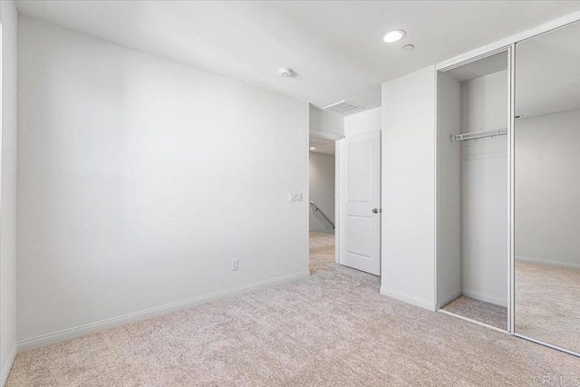8608 Amherst St, Santee, CA 92071 - unfurnished bedroom with a closet, light carpet, and recessed lighting