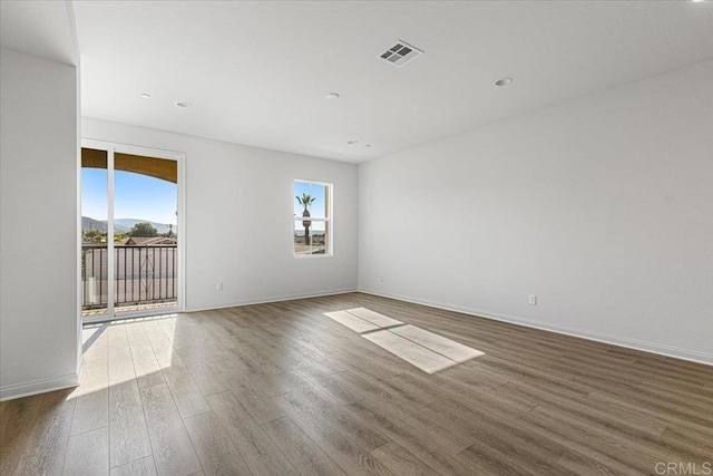 8608 Amherst St, Santee, CA 92071 - spare room featuring healthy amount of natural light, wood finished floors, and recessed lighting