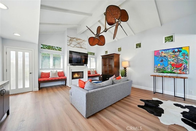 232 7th St, Seal Beach, CA 90740 - living room featuring wood finished floors and a warm lit fireplace
