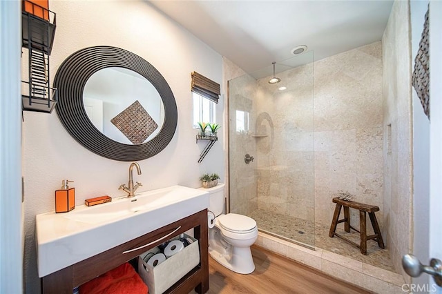 232 7th St, Seal Beach, CA 90740 - full bath with a tile shower, vanity, and wood finished floors