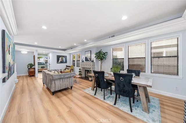 232 7th St, Seal Beach, CA 90740 - dining area featuring light wood-style floors, a brick fireplace, and recessed lighting