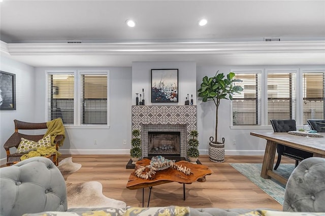 232 7th St, Seal Beach, CA 90740 - living room with wood finished floors, a tile fireplace, and recessed lighting