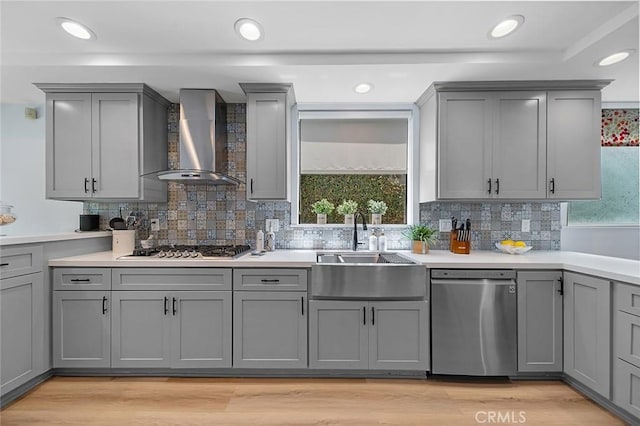 232 7th St, Seal Beach, CA 90740 - kitchen featuring stainless steel appliances, wall chimney exhaust hood, gray cabinets, decorative backsplash, and recessed lighting