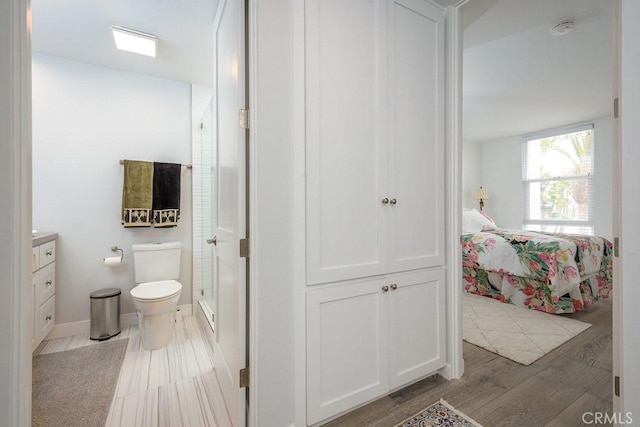 4073 Aladdin Dr, Huntington Beach, CA 92649 - ensuite bathroom with a stall shower, wood finished floors, and vanity