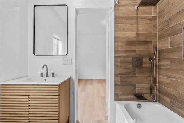 606 N Bonnie Brae St, Los Angeles, CA 90026 - full bath with vanity, shower / bath combination, and wood finished floors