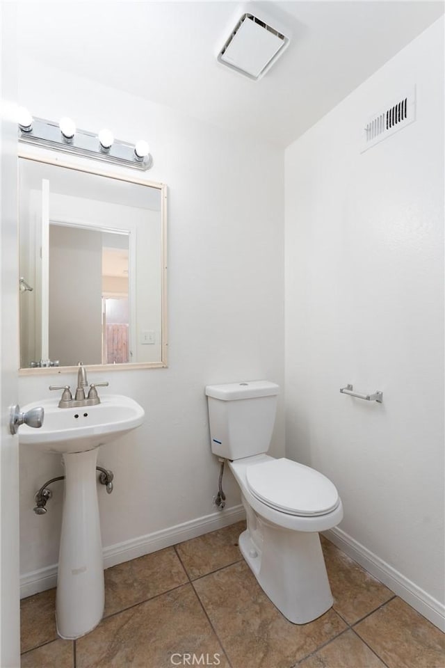 17571 Shamrock Ave, Fontana, CA 92336 - half bath featuring tile patterned flooring and toilet