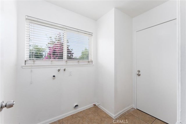 17571 Shamrock Ave, Fontana, CA 92336 - laundry area with hookup for a washing machine, hookup for an electric dryer, and light tile patterned flooring