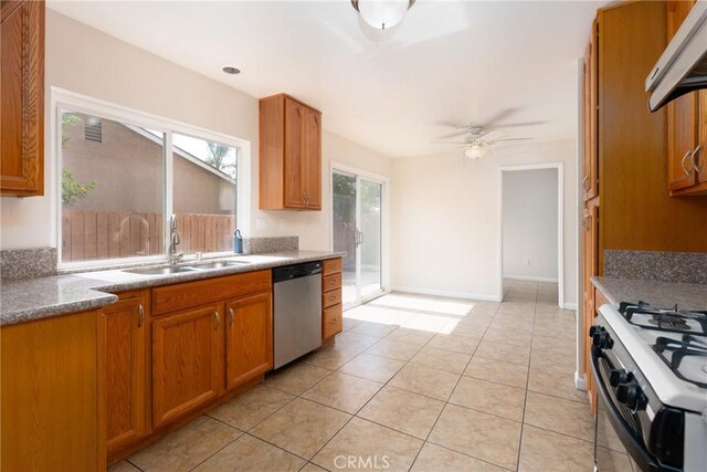 17571 Shamrock Ave, Fontana, CA 92336 - kitchen with dishwasher, ventilation hood, brown cabinets, white gas range oven, and a ceiling fan