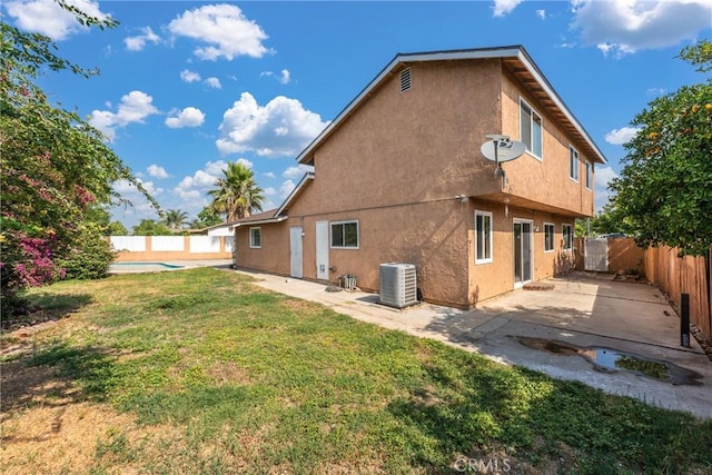 17571 Shamrock Ave, Fontana, CA 92336 - rear view of property featuring stucco siding, a fenced backyard, and a patio area