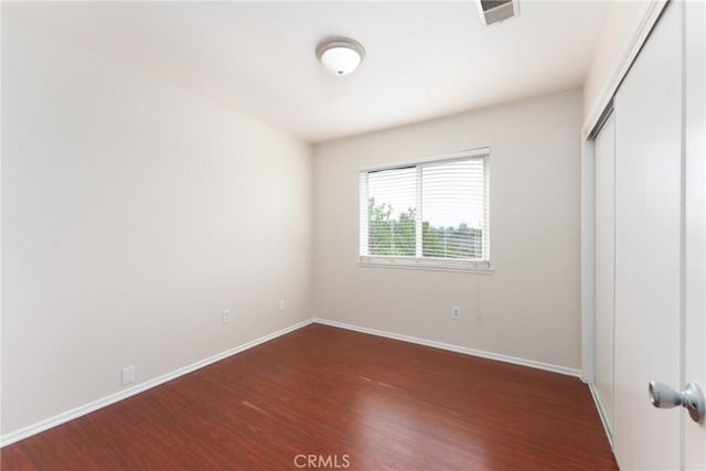 17571 Shamrock Ave, Fontana, CA 92336 - unfurnished bedroom with wood finished floors and a closet