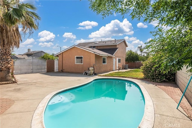 17571 Shamrock Ave, Fontana, CA 92336 - view of swimming pool with a gate, a patio area, and a fenced backyard