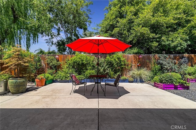 10 Harmony Park Cir, Chico, CA 95973 - fenced backyard featuring a patio and outdoor dining space