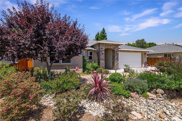 10 Harmony Park Cir, Chico, CA 95973 - view of front of house featuring an attached garage, stucco siding, and stone siding