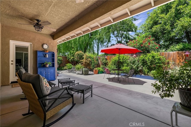 10 Harmony Park Cir, Chico, CA 95973 - fenced backyard featuring outdoor dining area, a ceiling fan, and a patio area