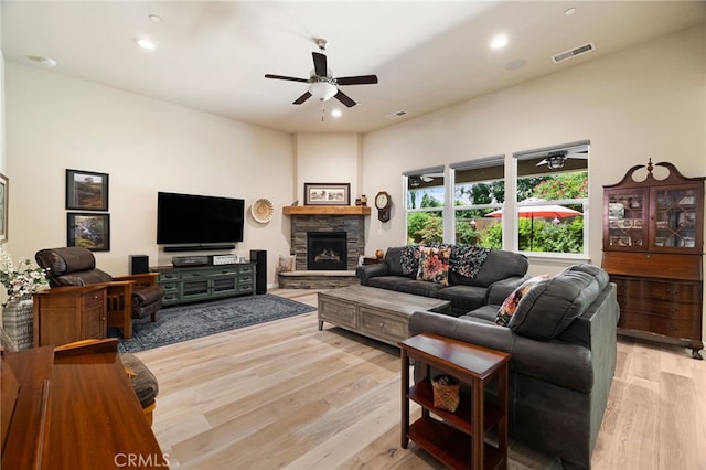10 Harmony Park Cir, Chico, CA 95973 - living room featuring ceiling fan, light wood-type flooring, recessed lighting, and a stone fireplace