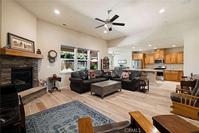 10 Harmony Park Cir, Chico, CA 95973 - living room featuring ceiling fan, a fireplace, light wood-style flooring, and recessed lighting