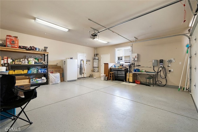 10 Harmony Park Cir, Chico, CA 95973 - garage featuring freestanding refrigerator, strapped water heater, and a garage door opener