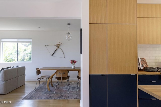 1070 Montecito Dr, Los Angeles, CA 90031 - interior space featuring light wood-style flooring, open floor plan, modern cabinets, light countertops, and decorative backsplash
