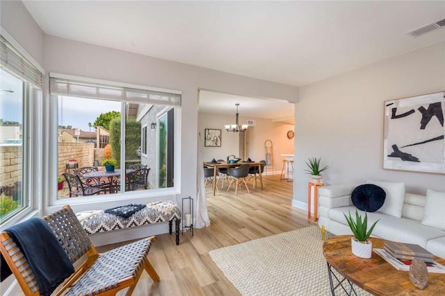 6313 Mockingbird St, Ventura, CA 93003 - living area with a chandelier and light wood-style floors