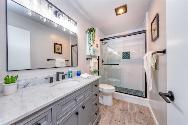6313 Mockingbird St, Ventura, CA 93003 - bathroom featuring wood finished floors, vanity, and a stall shower