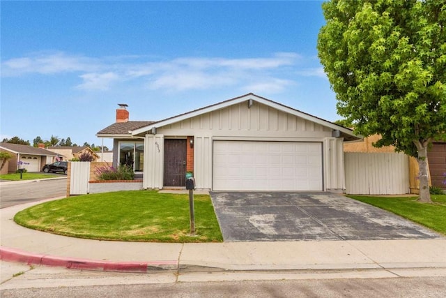 6313 Mockingbird St, Ventura, CA 93003 - single story home with an attached garage, asphalt driveway, and a chimney
