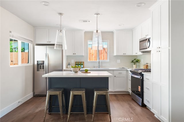 112 W Norwood Pl, San Gabriel, CA 91776 - kitchen featuring stainless steel appliances, white cabinets, and dark wood finished floors