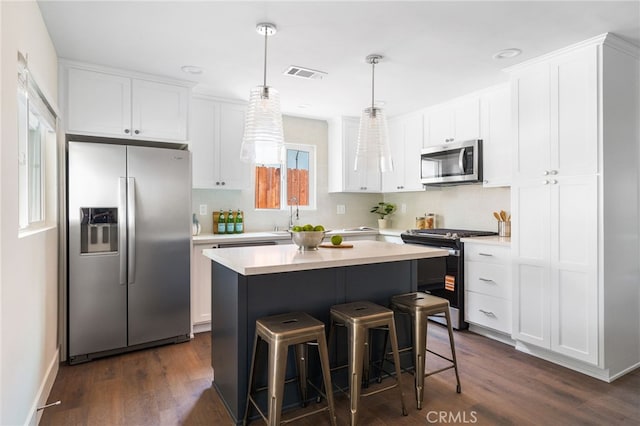 112 W Norwood Pl, San Gabriel, CA 91776 - kitchen featuring stainless steel appliances, tasteful backsplash, and white cabinetry