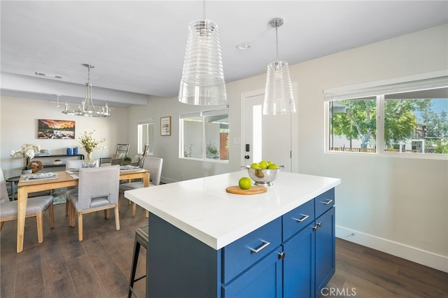 112 W Norwood Pl, San Gabriel, CA 91776 - kitchen featuring blue cabinetry, dark wood-style flooring, a kitchen island, light countertops, and decorative light fixtures