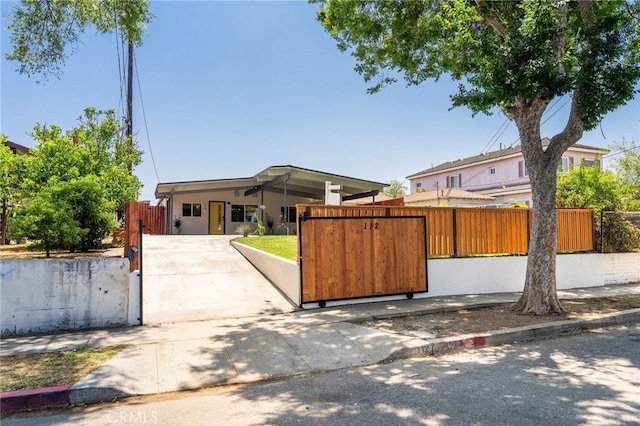 112 W Norwood Pl, San Gabriel, CA 91776 - view of front facade featuring a fenced front yard, a gate, and driveway