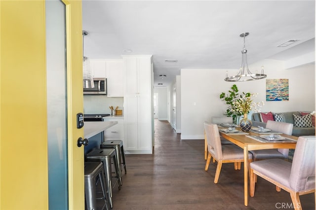 112 W Norwood Pl, San Gabriel, CA 91776 - dining room featuring dark wood-style floors and baseboards