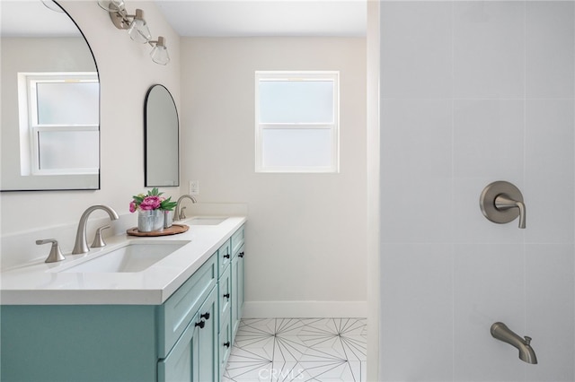112 W Norwood Pl, San Gabriel, CA 91776 - full bathroom with healthy amount of natural light, double vanity, and tile patterned flooring