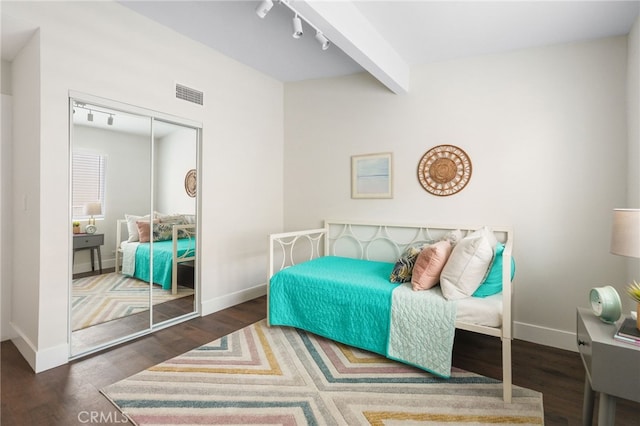 112 W Norwood Pl, San Gabriel, CA 91776 - bedroom featuring wood finished floors, rail lighting, a closet, and beam ceiling