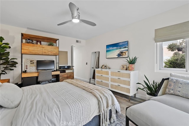 33586 Via Corvalian Unit 23, Dana Point, CA 92629 - bedroom featuring wood finished floors, a ceiling fan, and built in study area