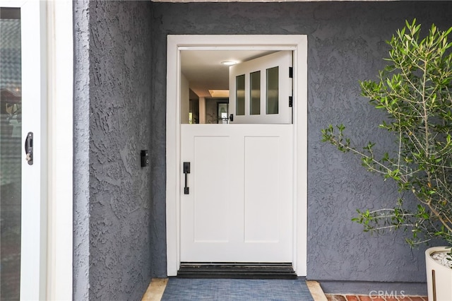 33586 Via Corvalian Unit 23, Dana Point, CA 92629 - doorway to property featuring stucco siding