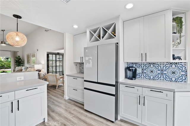 33586 Via Corvalian Unit 23, Dana Point, CA 92629 - kitchen with freestanding refrigerator, open shelves, light countertops, white cabinets, and recessed lighting