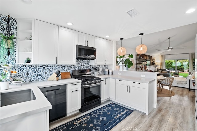 33586 Via Corvalian Unit 23, Dana Point, CA 92629 - kitchen with appliances with stainless steel finishes, open shelves, a peninsula, white cabinetry, and recessed lighting