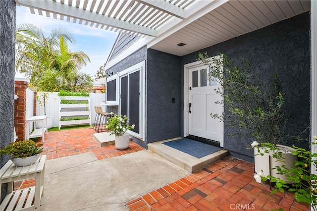 33586 Via Corvalian Unit 23, Dana Point, CA 92629 - entrance to property featuring stucco siding and a pergola