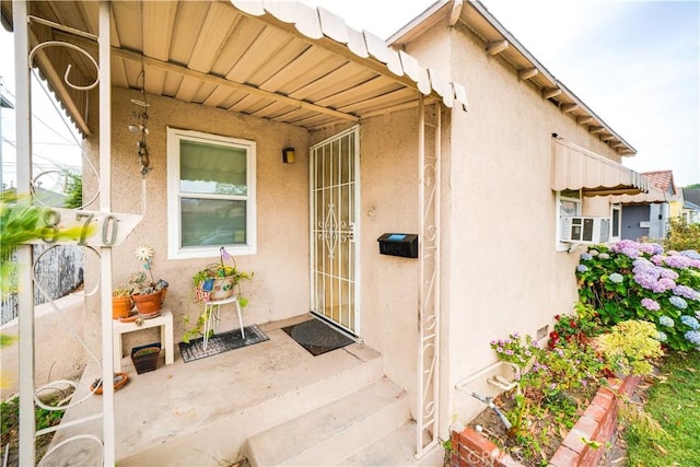 5870 Lemon Ave, Long Beach, CA 90805 - view of exterior entry featuring stucco siding and cooling unit