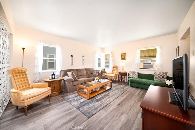 5870 Lemon Ave, Long Beach, CA 90805 - living room featuring healthy amount of natural light, cooling unit, and wood finished floors