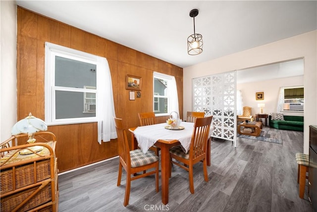 5870 Lemon Ave, Long Beach, CA 90805 - dining room featuring wood finished floors, wood walls, and cooling unit