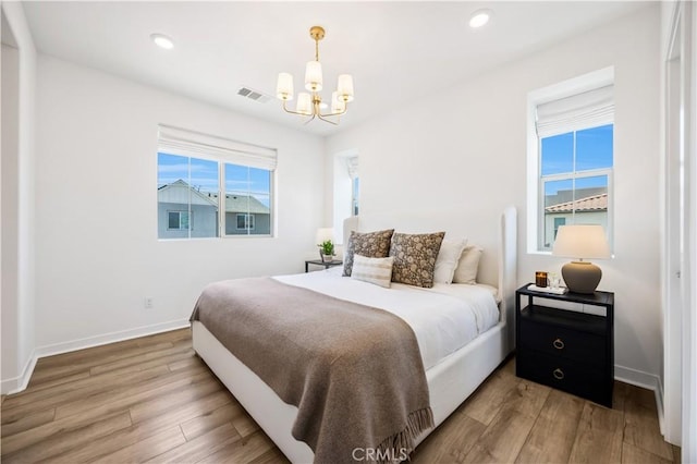 111 Juniper Dr, Rancho Mission Viejo, CA 92694 - bedroom featuring a chandelier, wood finished floors, and recessed lighting