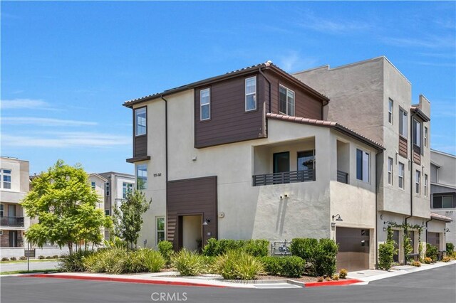 111 Juniper Dr, Rancho Mission Viejo, CA 92694 - view of building exterior featuring a garage