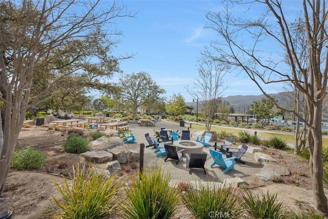 111 Juniper Dr, Rancho Mission Viejo, CA 92694 - view of patio / terrace with an outdoor fire pit and a mountain view