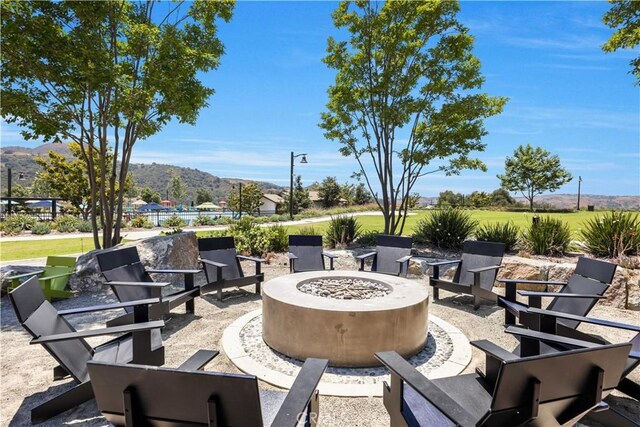 111 Juniper Dr, Rancho Mission Viejo, CA 92694 - view of patio / terrace with an outdoor fire pit and a mountain view