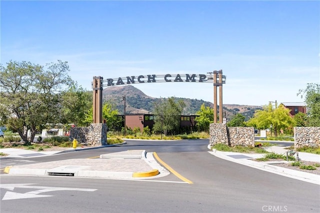 111 Juniper Dr, Rancho Mission Viejo, CA 92694 - view of asphalt street with curbs, a mountain view, and sidewalks