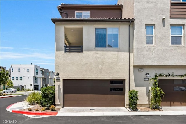 111 Juniper Dr, Rancho Mission Viejo, CA 92694 - townhome / multi-family property with stucco siding and a garage