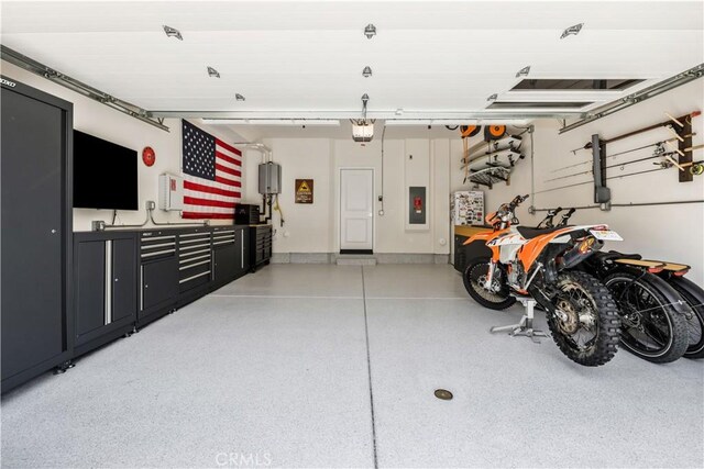 111 Juniper Dr, Rancho Mission Viejo, CA 92694 - garage featuring a garage door opener and electric panel