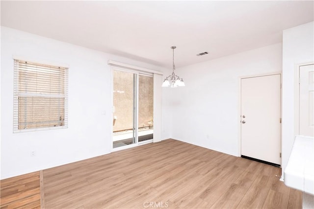 38133 Mendocino Way, Palmdale, CA 93550 - unfurnished room featuring a chandelier and light wood-style flooring