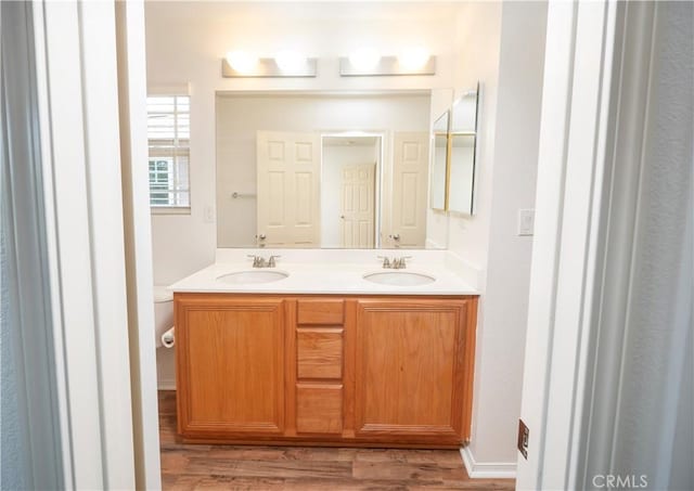 38133 Mendocino Way, Palmdale, CA 93550 - bathroom featuring double vanity and wood finished floors