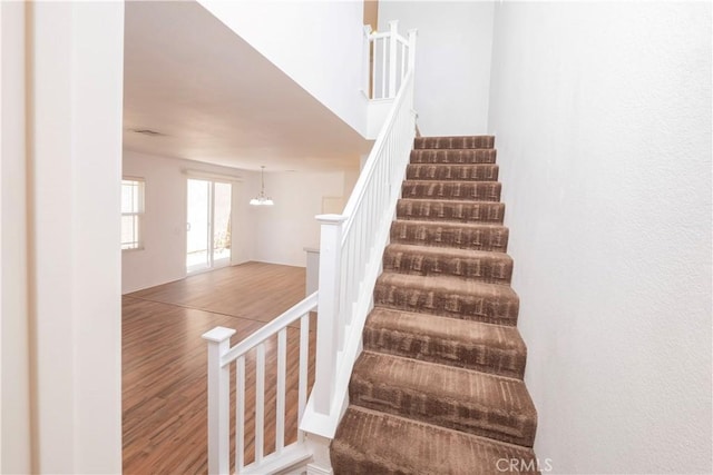 38133 Mendocino Way, Palmdale, CA 93550 - staircase featuring wood finished floors and a chandelier